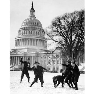 Senate Pages having a snowball fight outside the Capitol Building