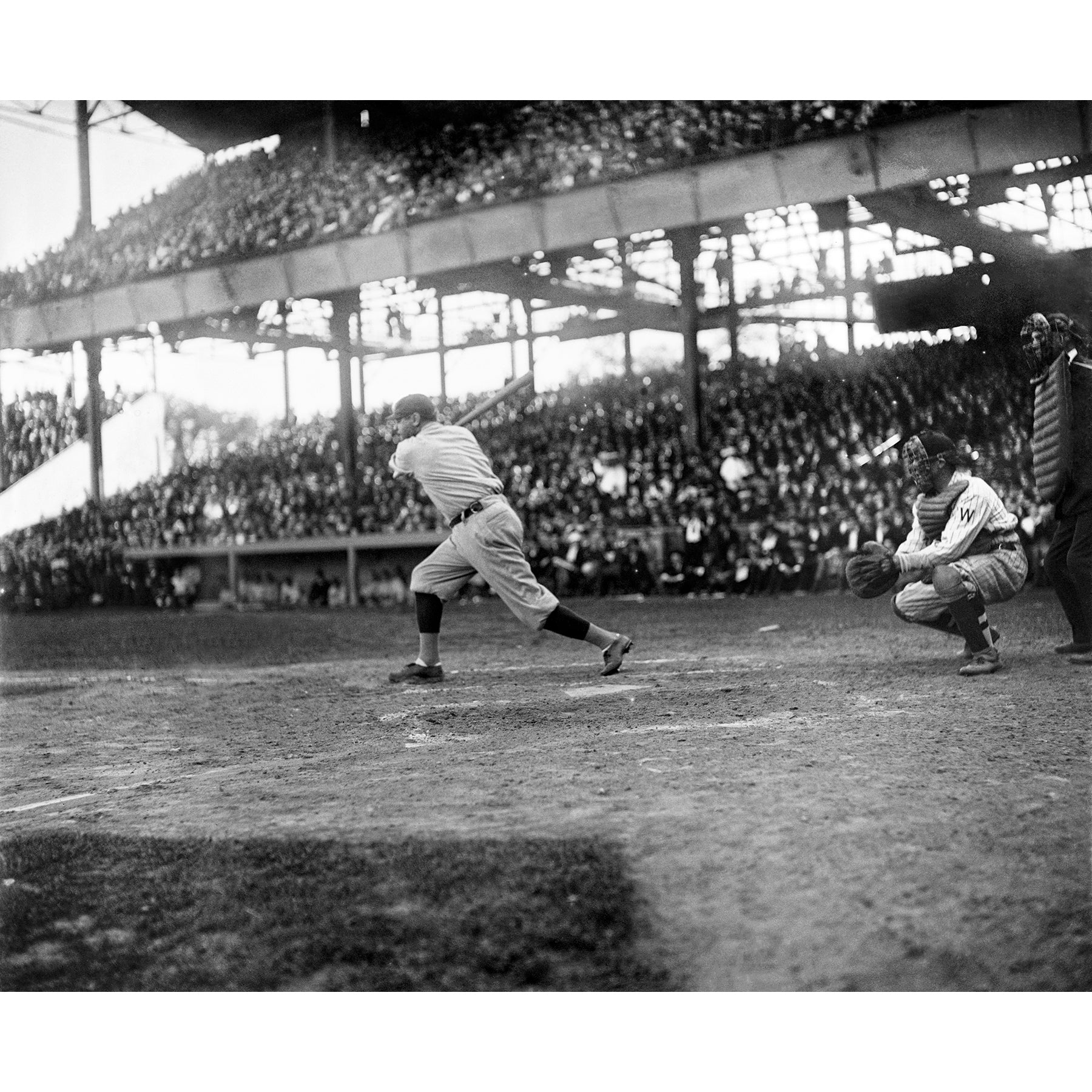 A vintage sports photograph of Babe Ruth at bat