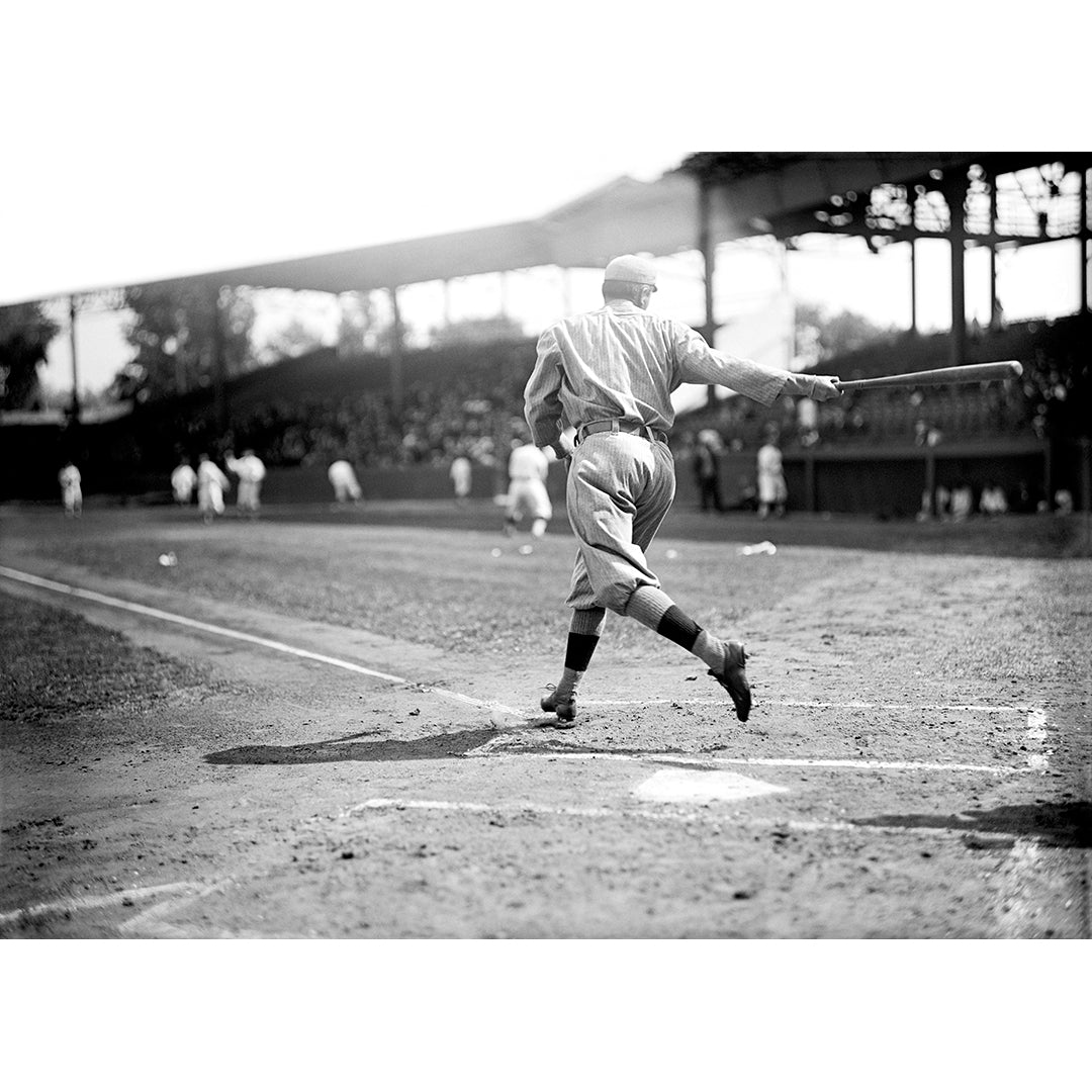 A vintage photograph of a baseball player with the Boson Red Sox