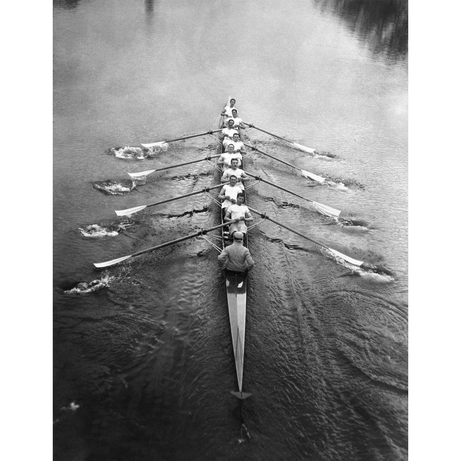 A vintage photograph of a Cambridge crew team on the river