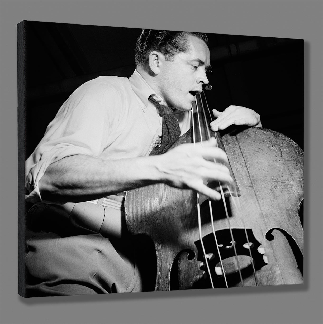 Canvas print mockup of vintage photo of Eddie Safranski playing live music