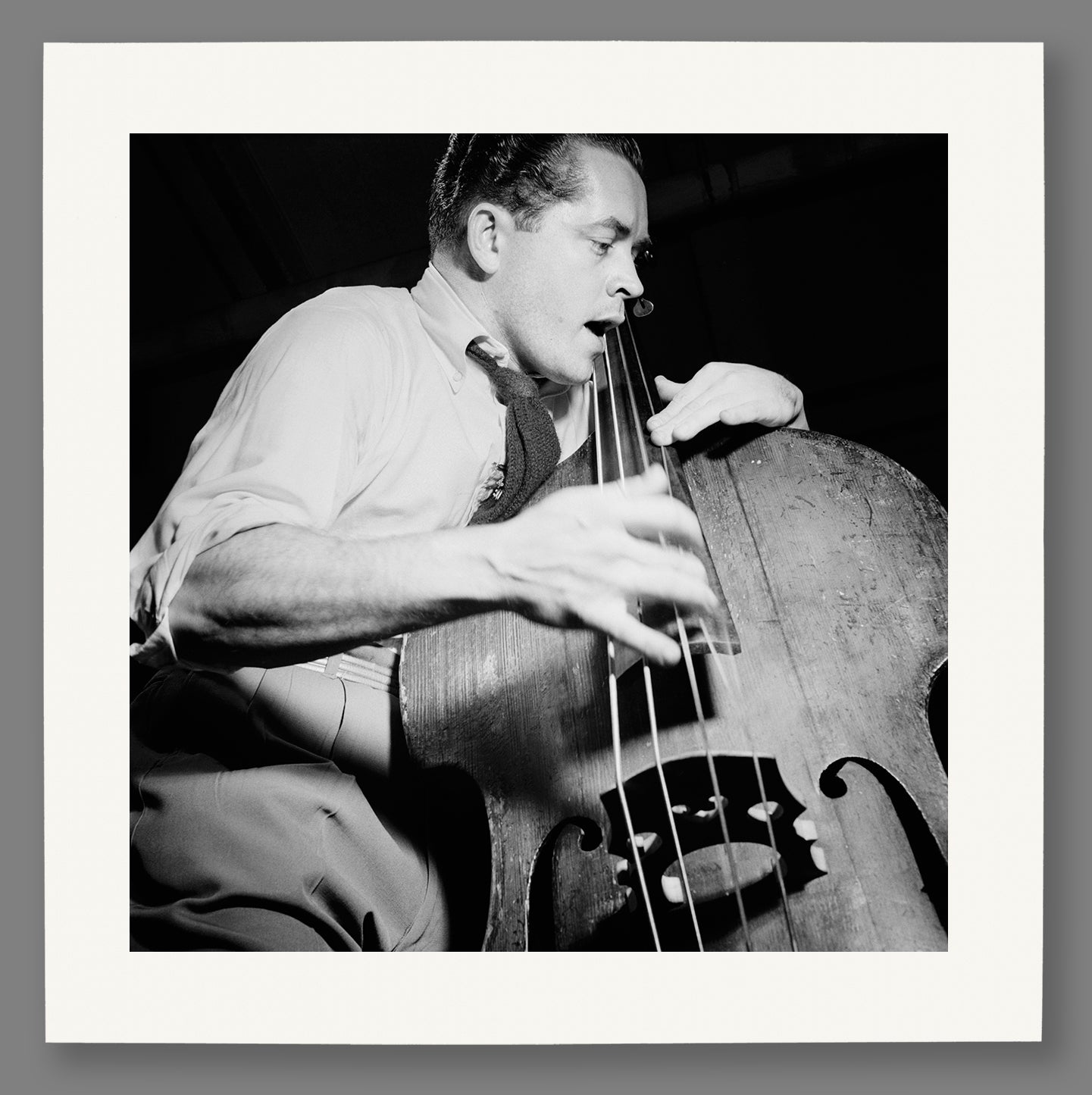 Paper print mockup of vintage photo of Eddie Safranski playing live music