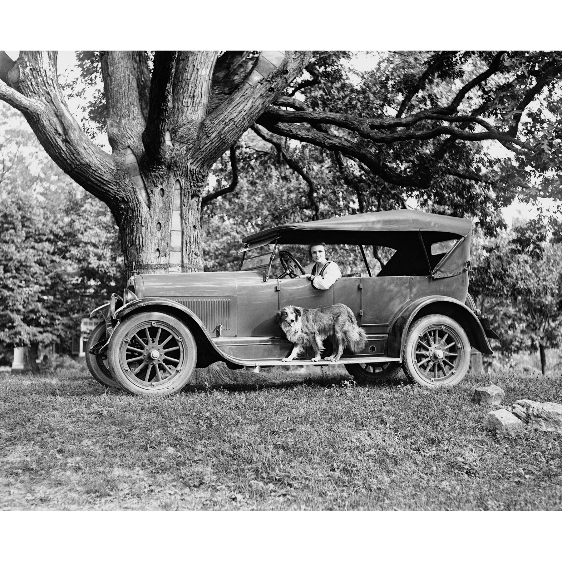A vintage photograph of a woman inside a vehicle from Jordan Motor Car Company