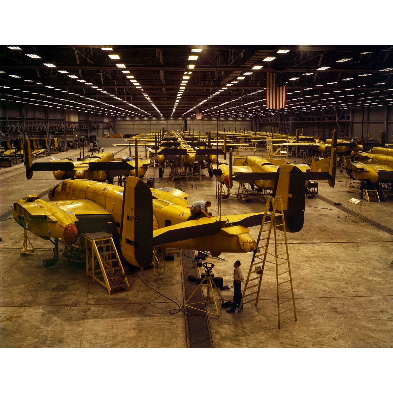 Vintage photograph of men assembling B-25 bombers in Kansas