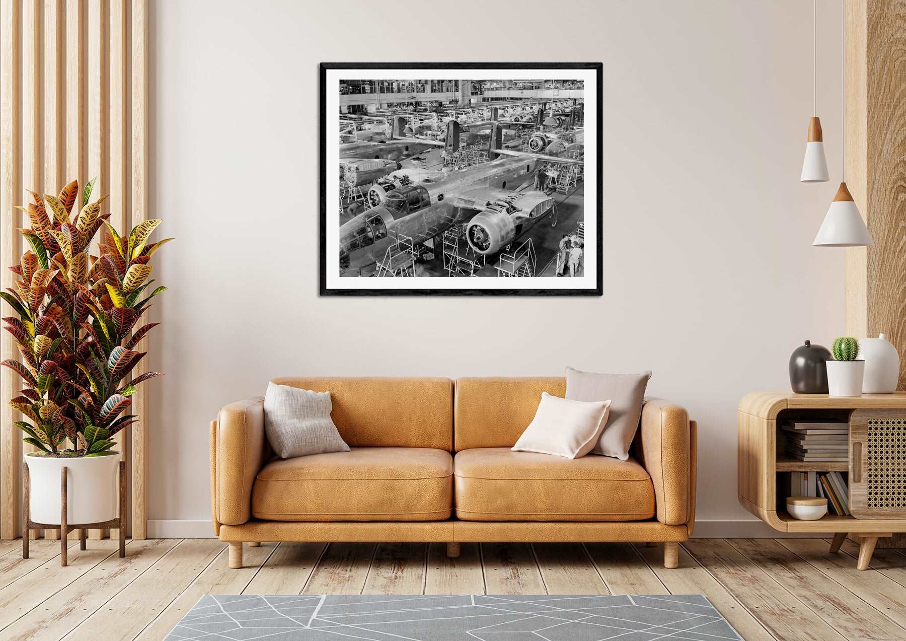 A photograph of a living room with a framed print on the wall of vintage photograph of B-25 Bombers