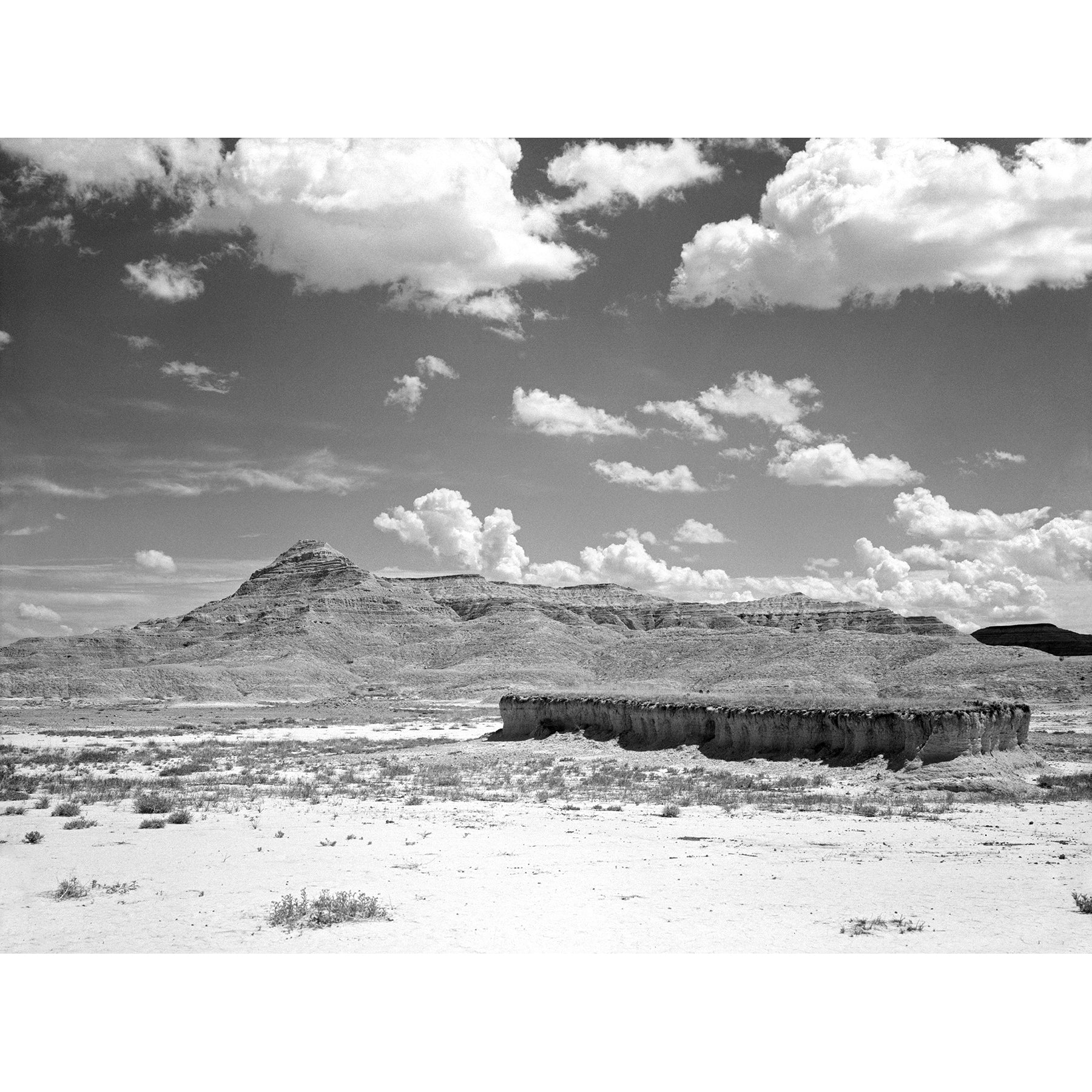 A vintage landscape photograph of Badlands National Park in South Dakota