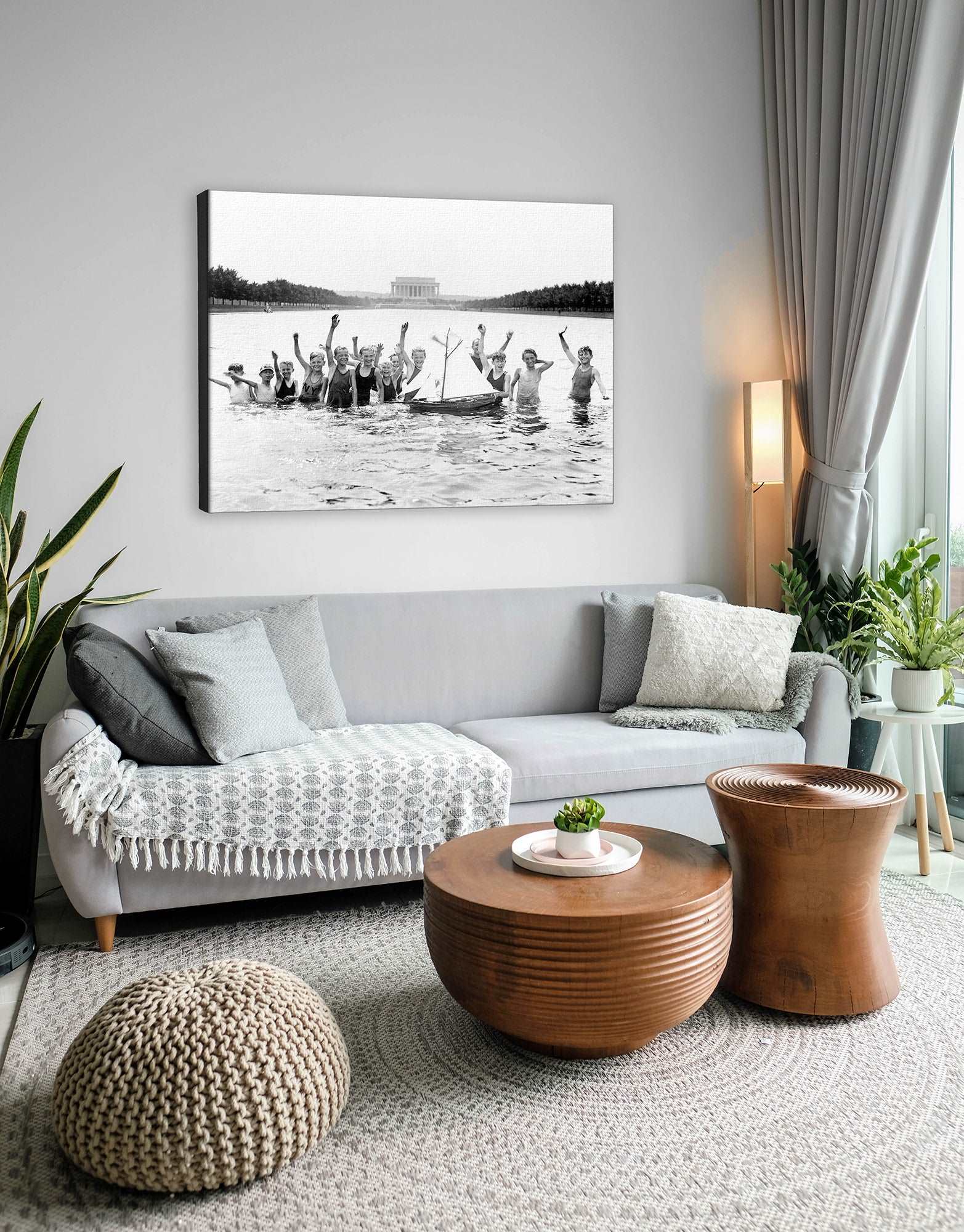 An image of a living room with a stretched canvas print on the wall