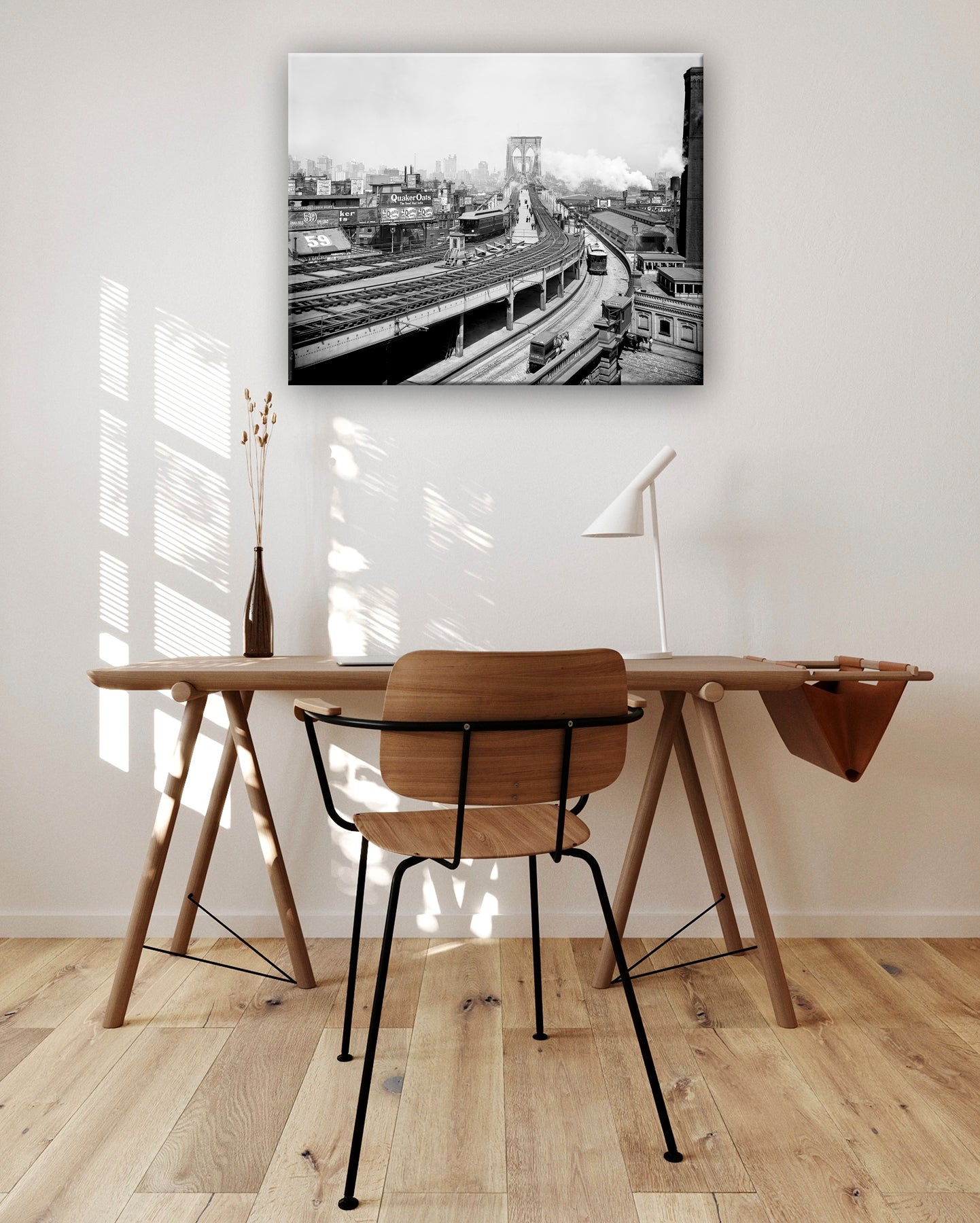 A vintage photo of the Brooklyn Railroad Terminal, digitally rendered as a canvas print hanging above a sunlit desk