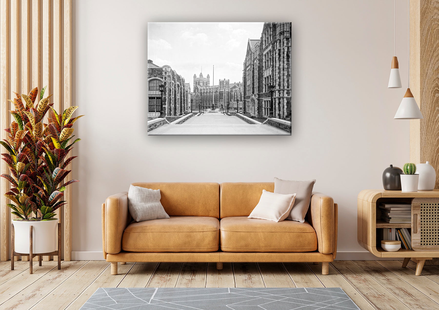 A photograph of a living room with a digital rendering of a canvas print reproduction of a vintage photo of City College hanging above the couch