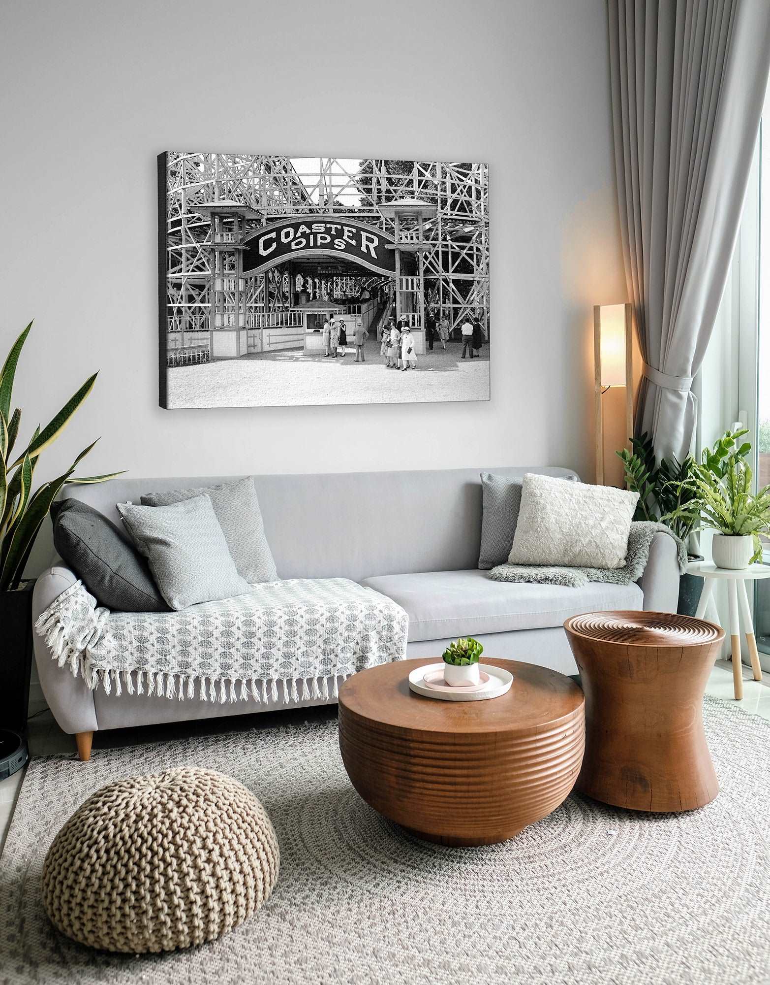A canvas print hanging on a wall in a living room, featuring a vintage photograph of Glen Echo park