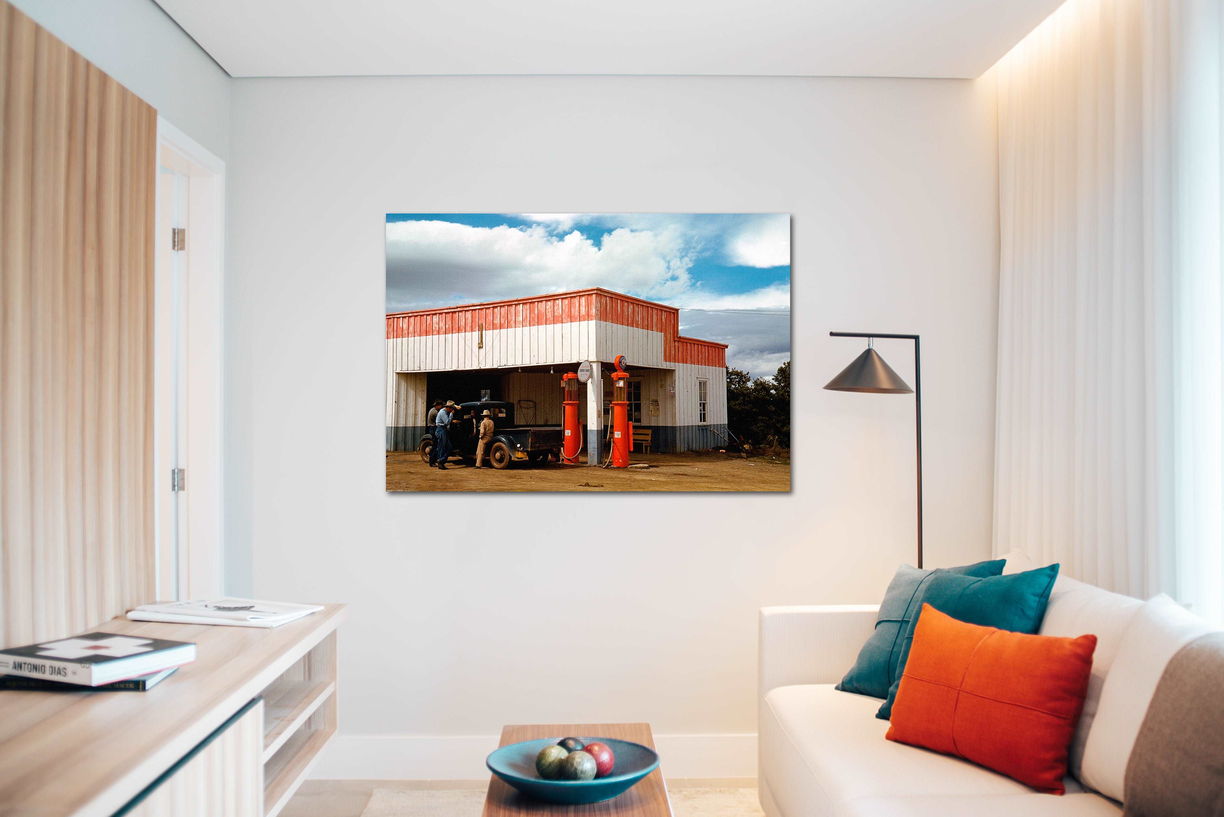 A modern living room with a canvas print of a vintage photograph of a New Mexico filling station