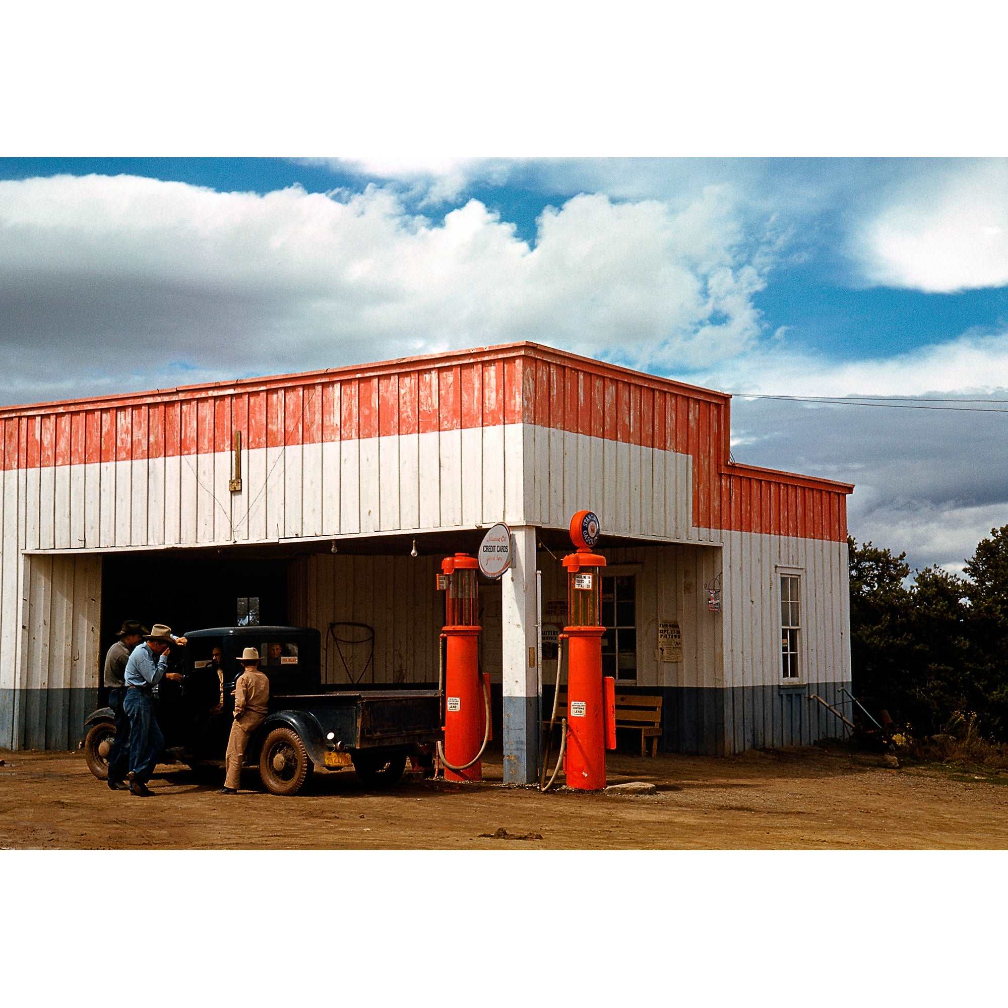 A vintage, color photograph of a filling station in New Mexico