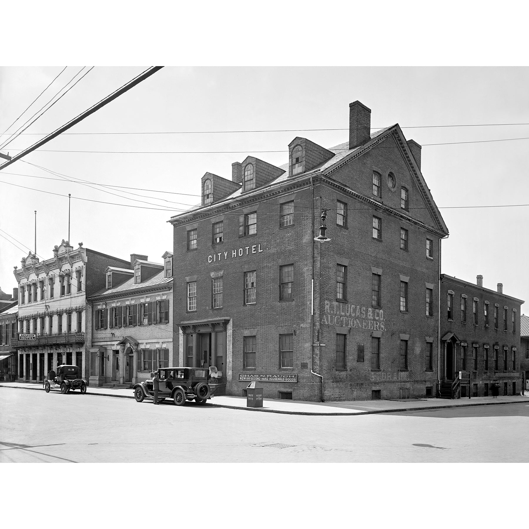 A vintage photograph of a Ford vehicle outside Gadsby's in Old Town Alexandria