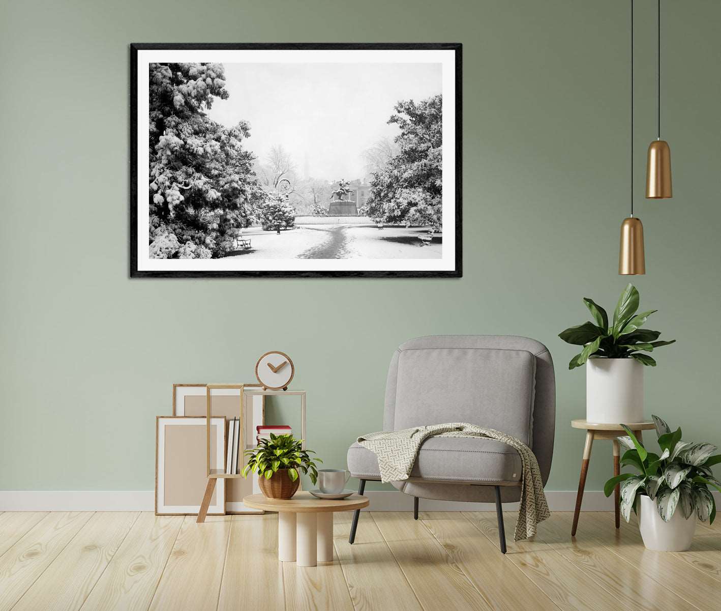 A photo of a living room with a green wall and a framed paper print of a photograph of Lafayette Park