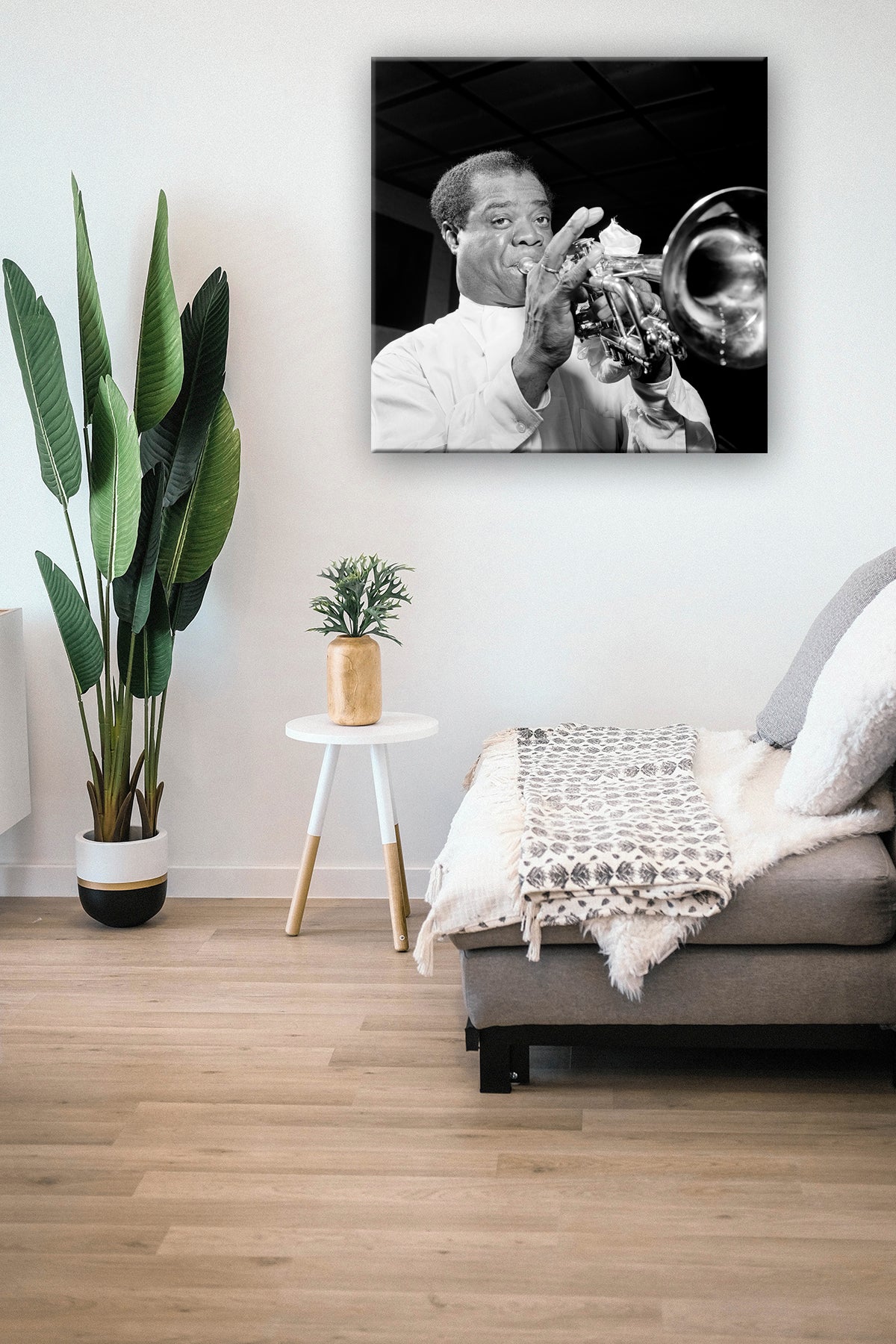A mockup featuring a canvas print of a vintage photograph of Louis Armstrong