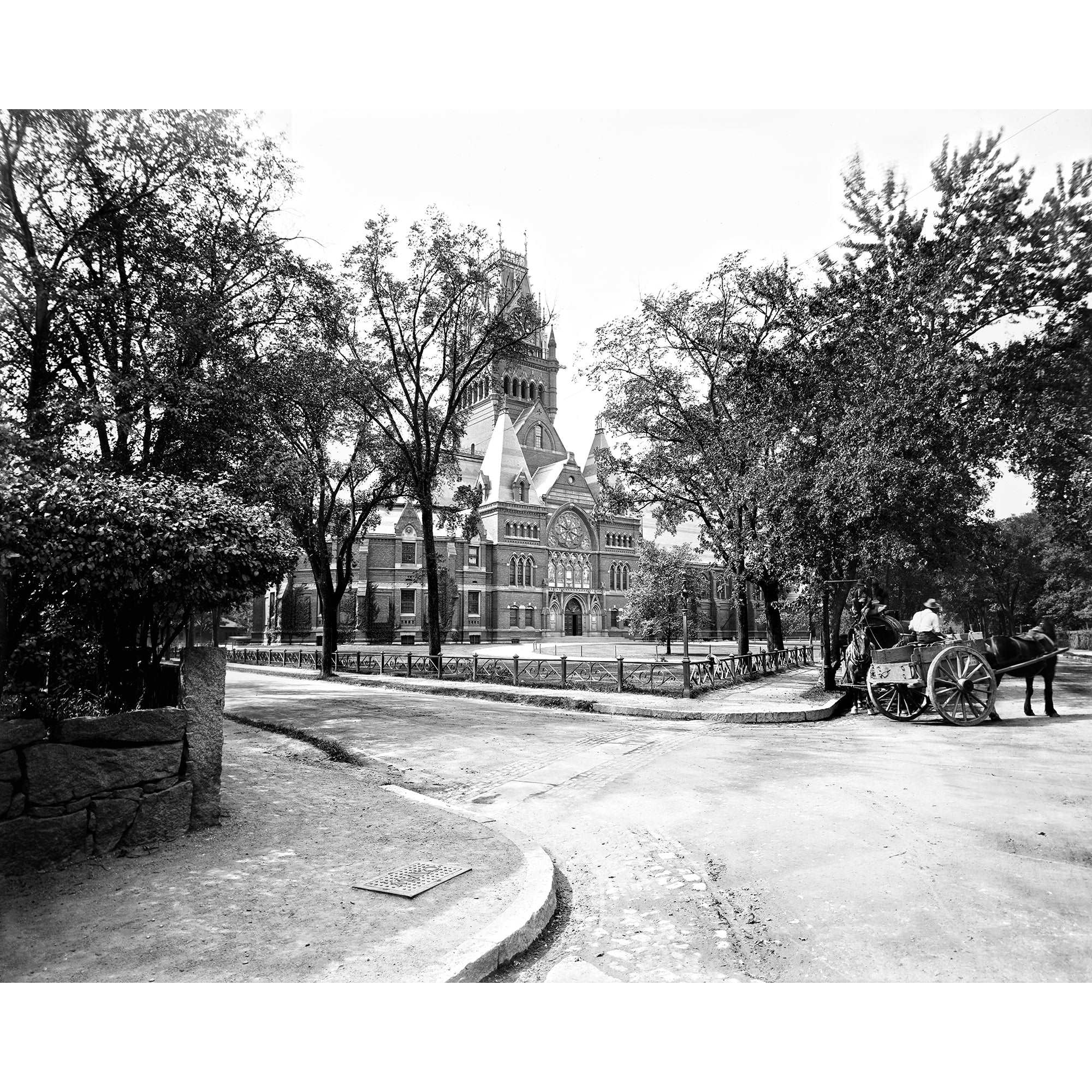 A vintage, black and white photograph of Memorial Hall at Harvard University