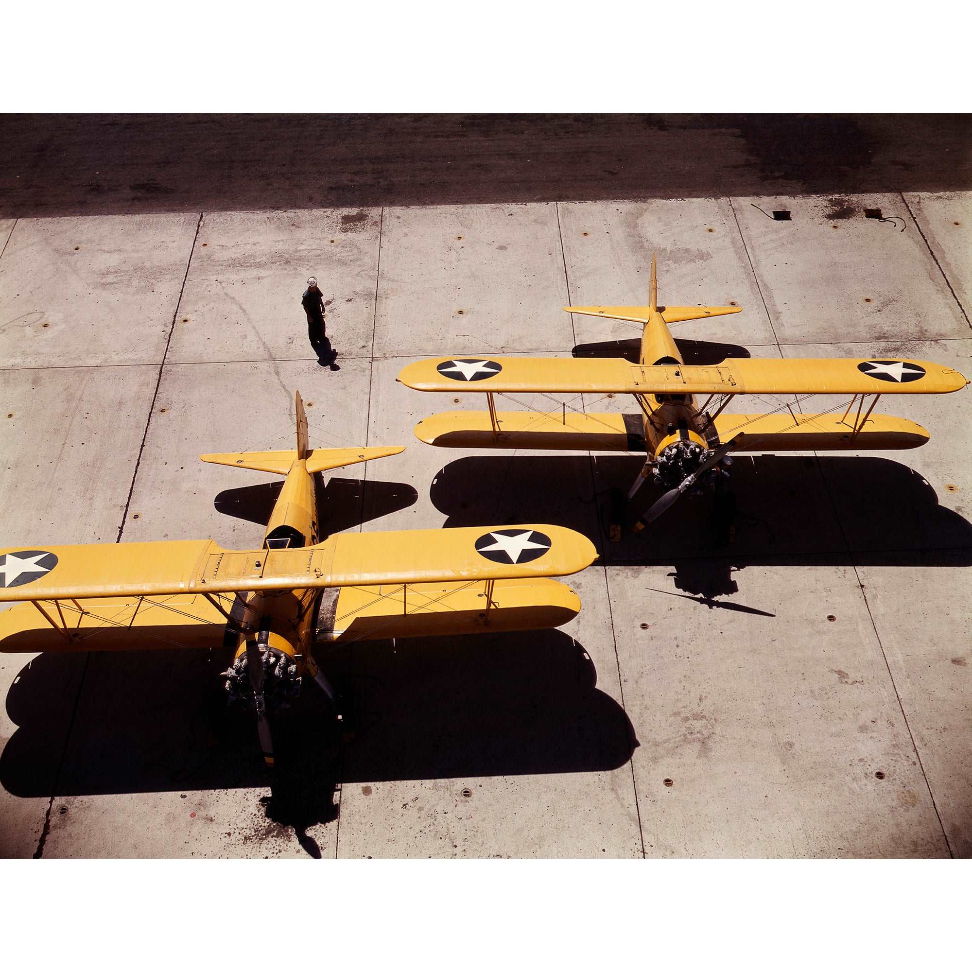 A vintage color photograph of Navy N2S planes