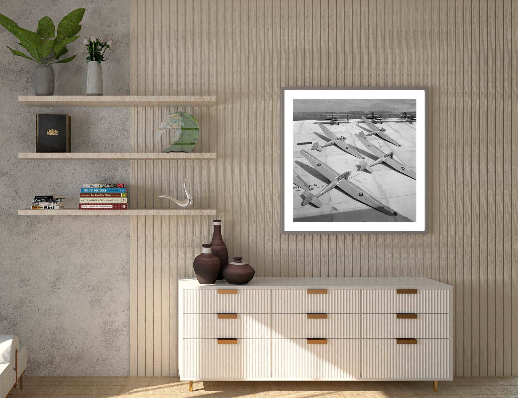 A room with shelves and a slatted wall, featuring a framed paper print of vintage photography