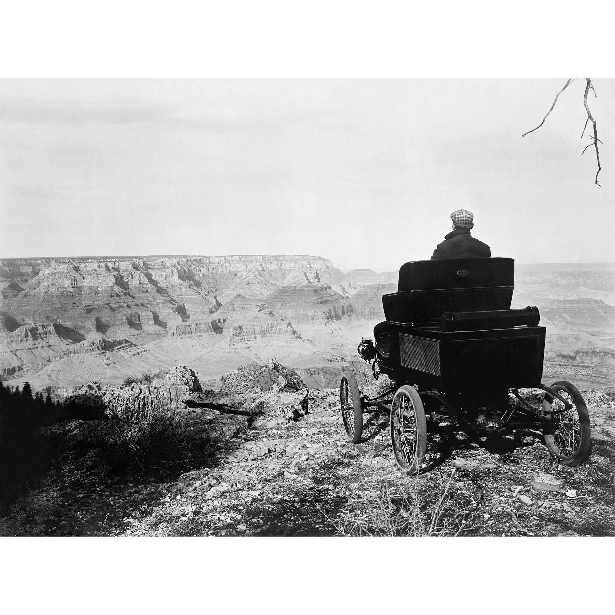 A vintage photograph of a pioneer automobile party member in a Toledo Car at the Grand Canyon