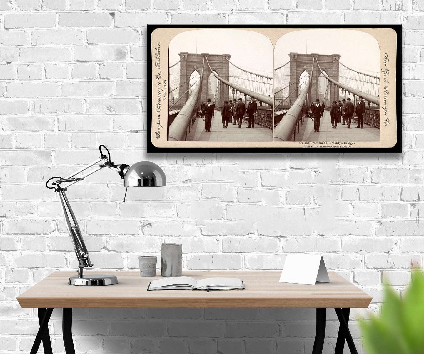 A digitally rendered office with a canvas print of a vintage stereograph image of the Brooklyn Bridge's Promenade