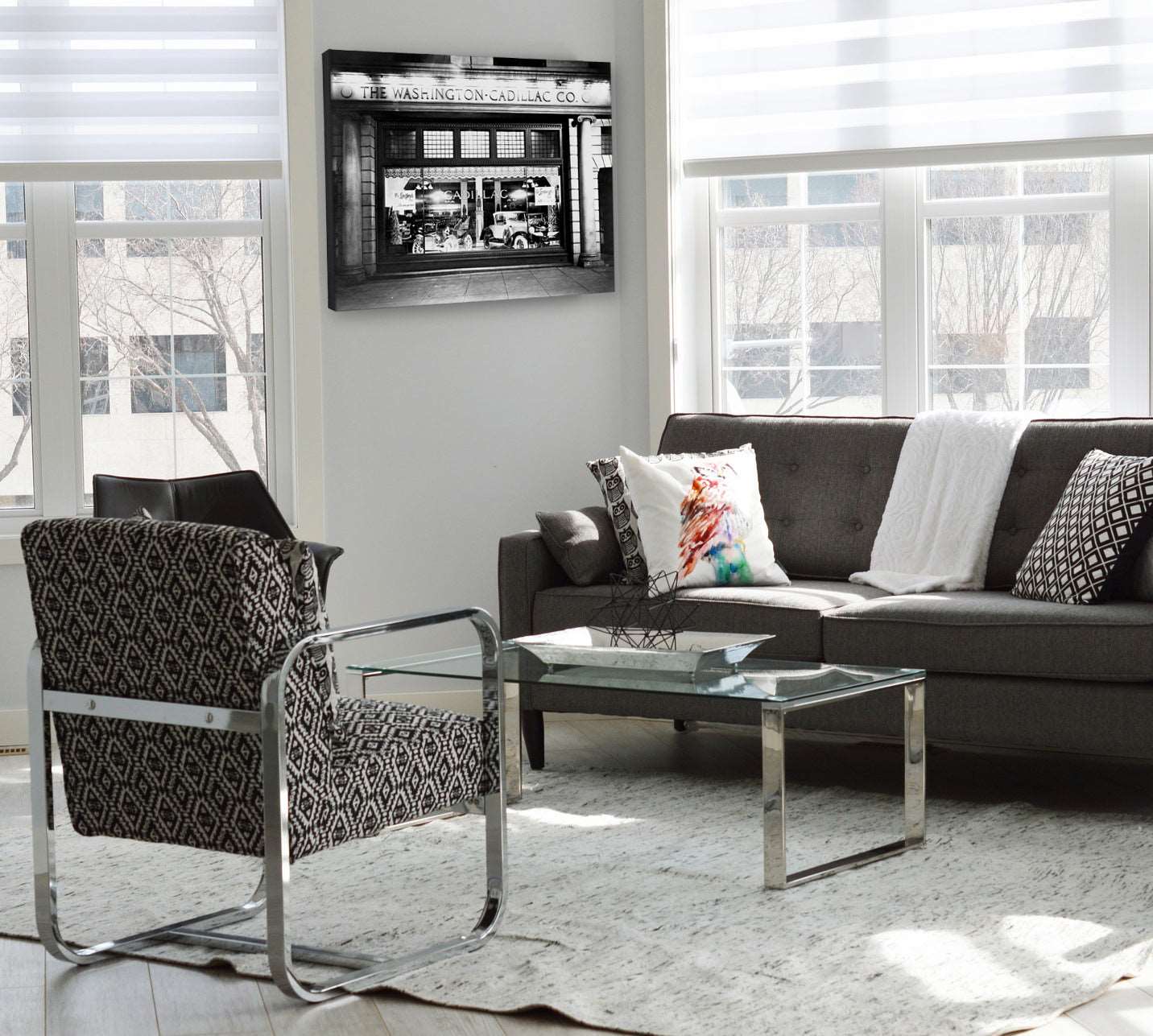 A mockup of a canvas print of a vintage photograph of the Washington Cadillac Co. hanging in a living room