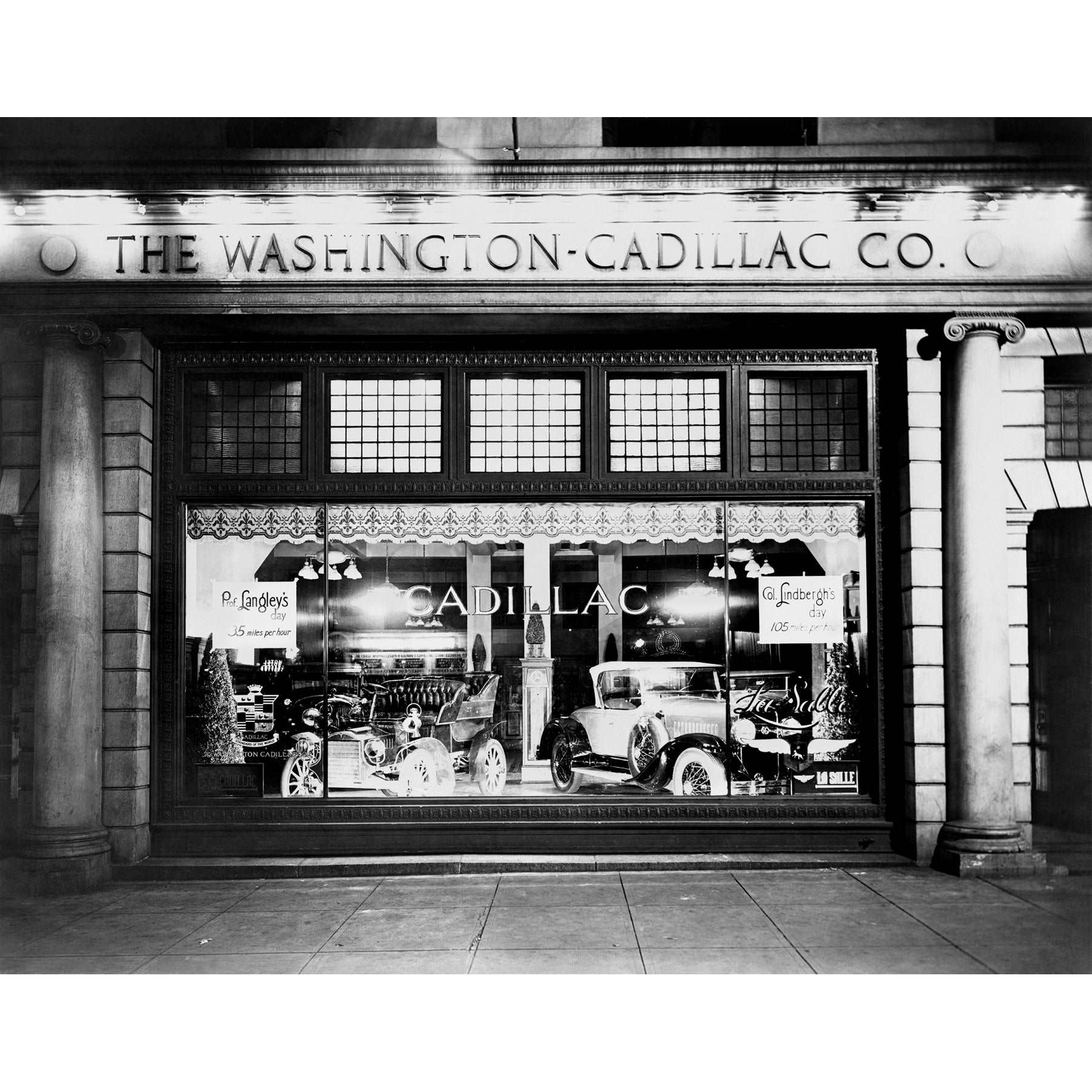 A vintage, black and white photograph of the Washington Cadillac Company's storefront