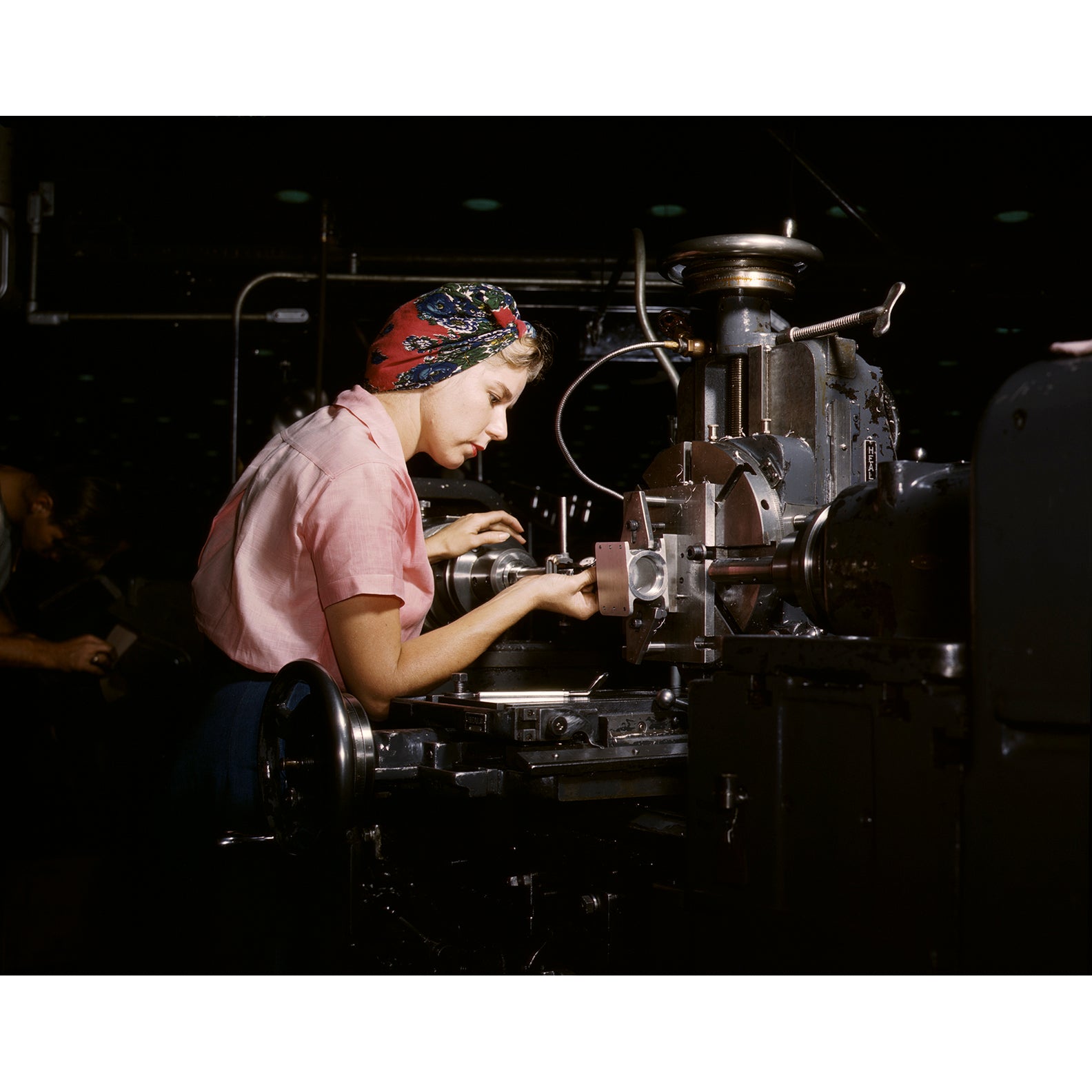 Vintage photograph featuring a woman working with machinery at Douglas Aircraft Company