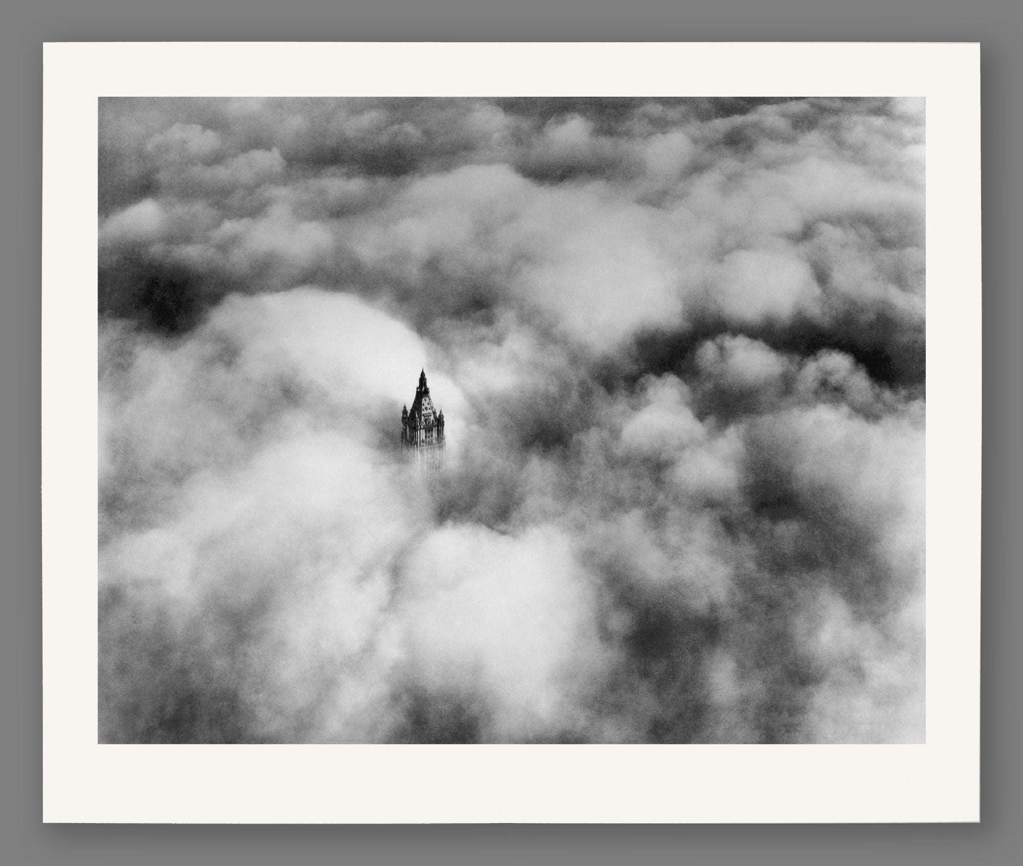 A digital mockup of a paper print featuring our vintage photograph of Woolworth Tower above the clouds