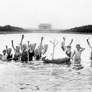 Boys swimming in the Reflecting Pool, Lincoln Memorial in the background