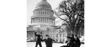 Senate Pages having a snowball fight outside the Capitol Building