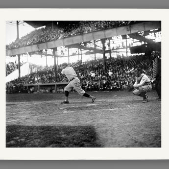 A paper print reproduction of a vintage photograph of Babe Ruth at bat