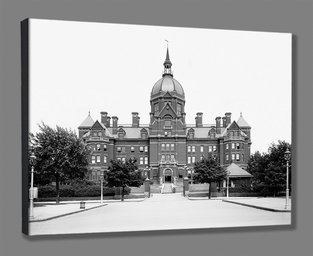 A digital mockup of a stretched canvas print, featuring a vintage photo of Johns Hopkins Hospital