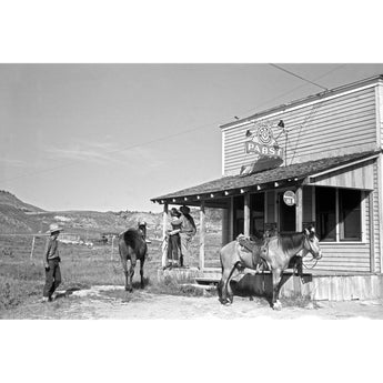 A vintage photograph of a trio of men outside a beer parlor in Birney, Montana