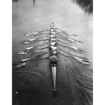 A vintage photograph of a Cambridge crew team on the river