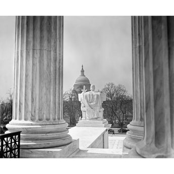 A vintage photograph of the US Capitol Building, as seen from the Supreme Court Building