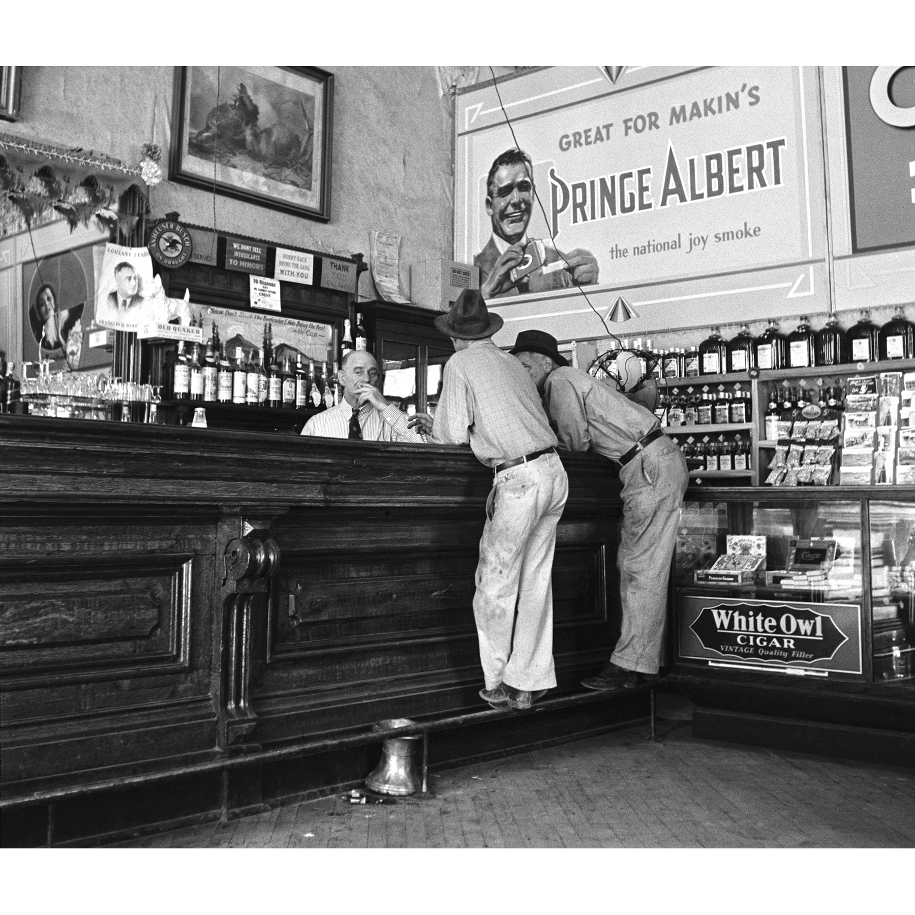 A vintage photograph of two men at the bar in a Saloon in Tombstone, Arizona