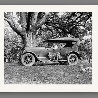 A mockup of a paper print of a vintage photograph of a Jordan Motor Car Company vehicle in front of a tree