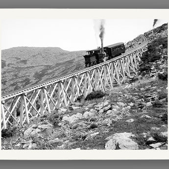 A fine art paper print of a vintage photograph of a train descending the tracks on Mt. Washington