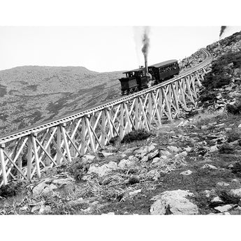 A vintage photograph showing a train descending Jacob's Ladder on Mount Washington in New Hampsire
