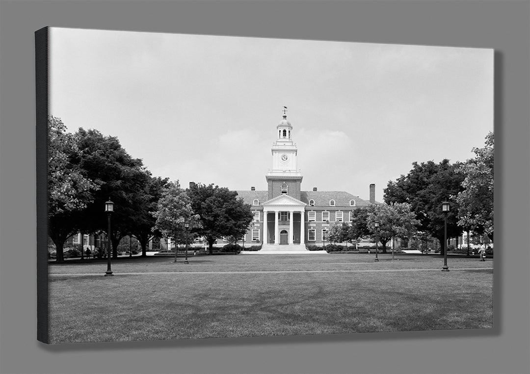 A mockup of a stretched canvas print, featuring a vintage image of Gilman Hall