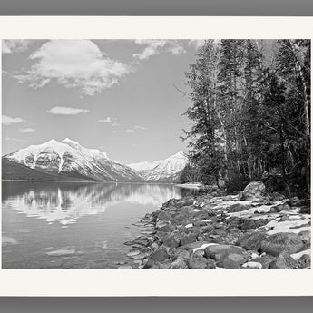 A reproduction print on paper of a vintage photograph of Lake McDonald in Glacier National Park