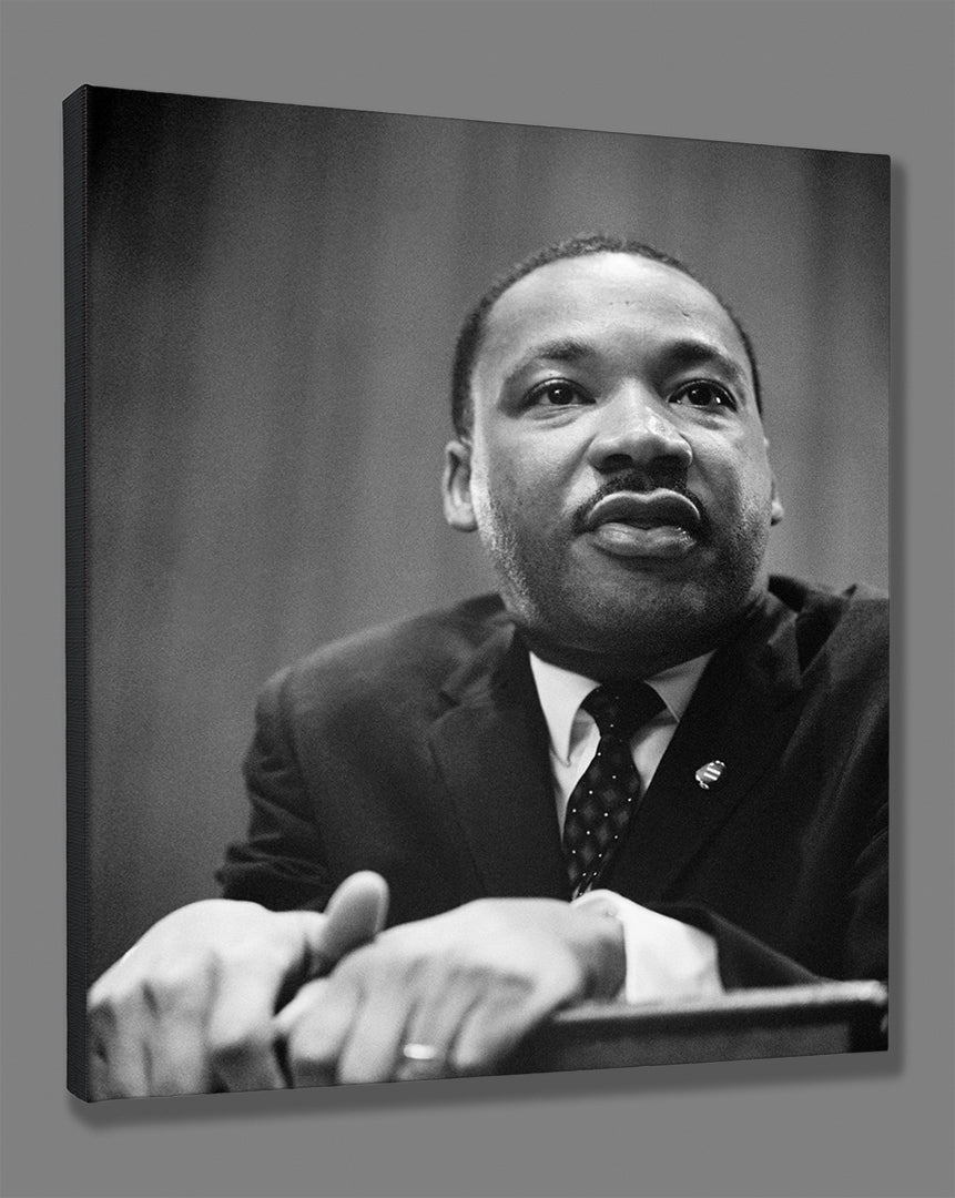 A stretched canvas print of a black and white portrait photograph of Martin Luther King, Jr