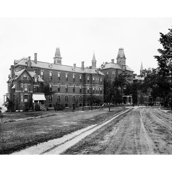 A vintage photograph of Maine General Hospital, a sprawling brick building surrounded by lawn and trees