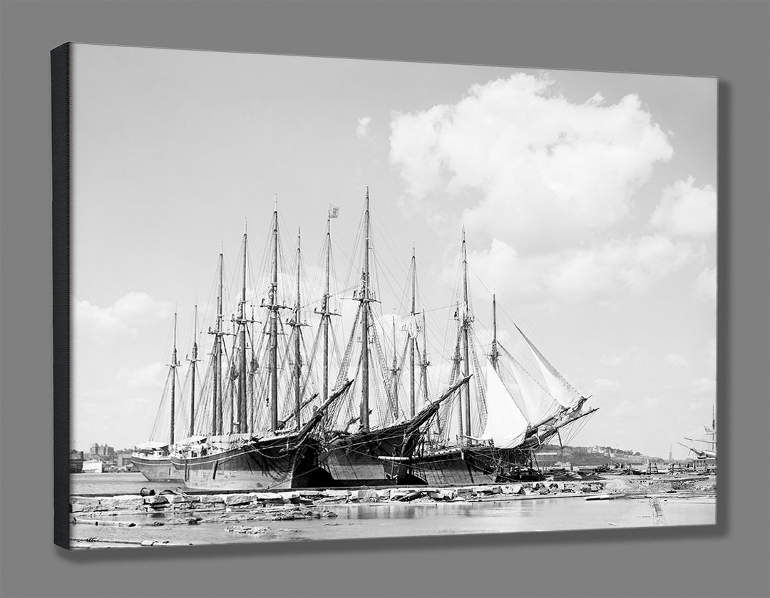 A mockup of a stretched canvas print of a black and white photo of ships docked in Portland, Maine