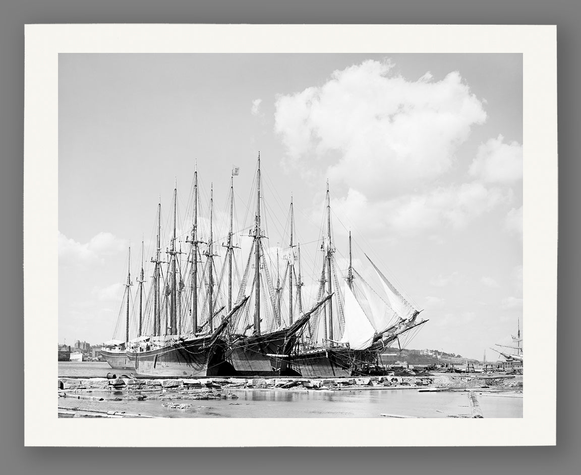 An archival print on paper of a vintage image of sailing ships docked in Portland, Maine