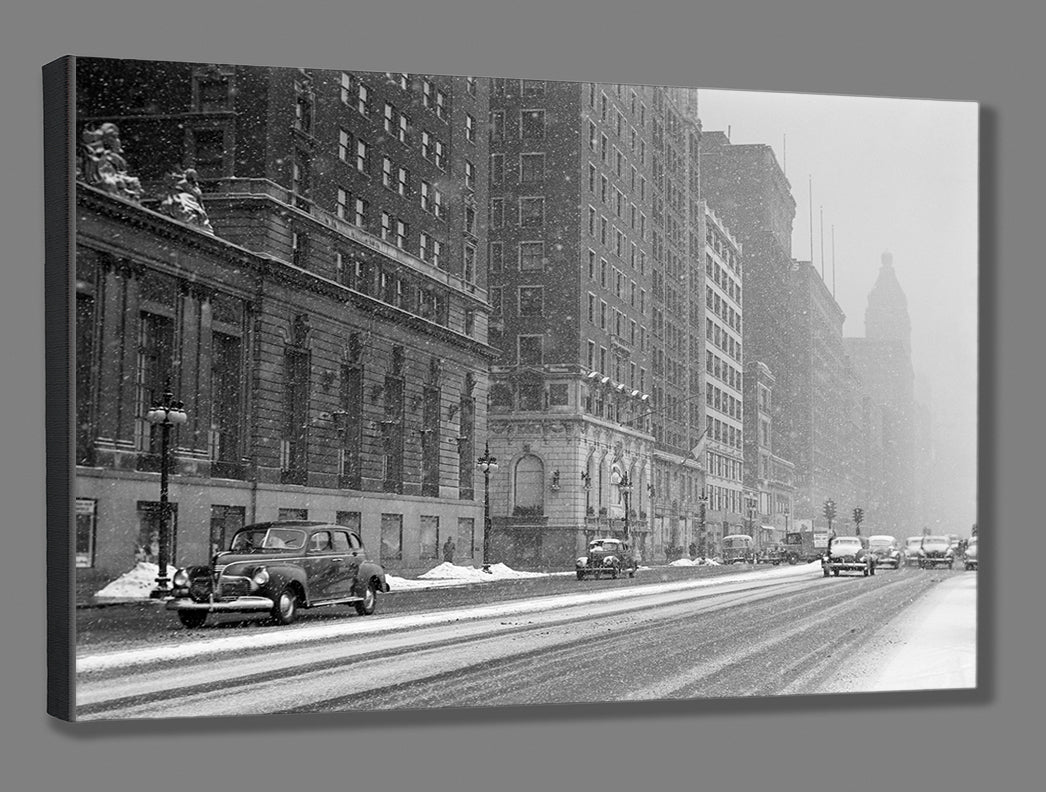A canvas reproduction print of a vintage photograph of Chicago's Michigan Avenue in the snow