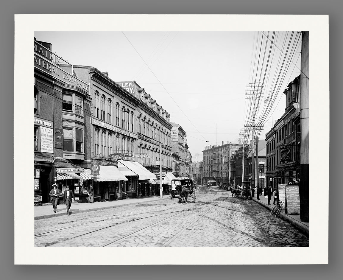 A fine art paper print of a vintage photograph depicting a regular day on Middle Street in Portland, Maine