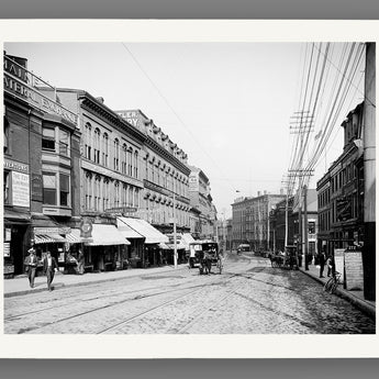 A fine art paper print of a vintage photograph depicting a regular day on Middle Street in Portland, Maine