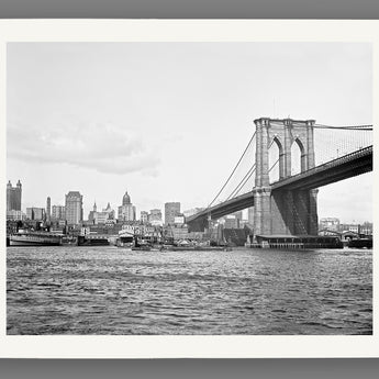 A black and white fine art print of a vintage image of the New York City skyline and Brooklyn Bridge