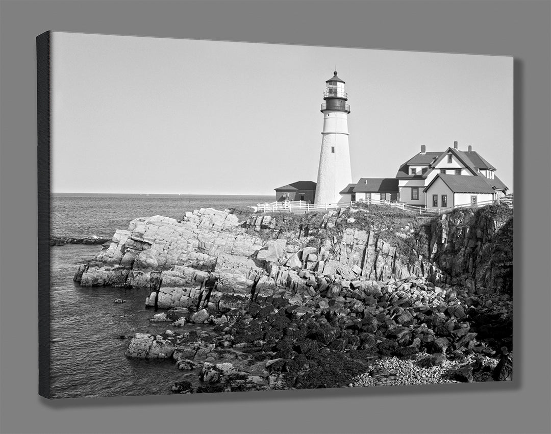 A stretched canvas print of a black and white photograph of a historic lighthouse in Portland, Maine